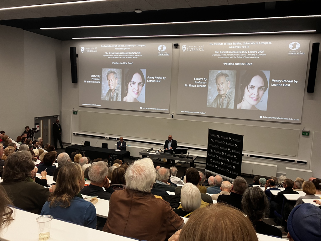 View from back of a lecture theatre with slides showing Simon Schama and Leanne Best